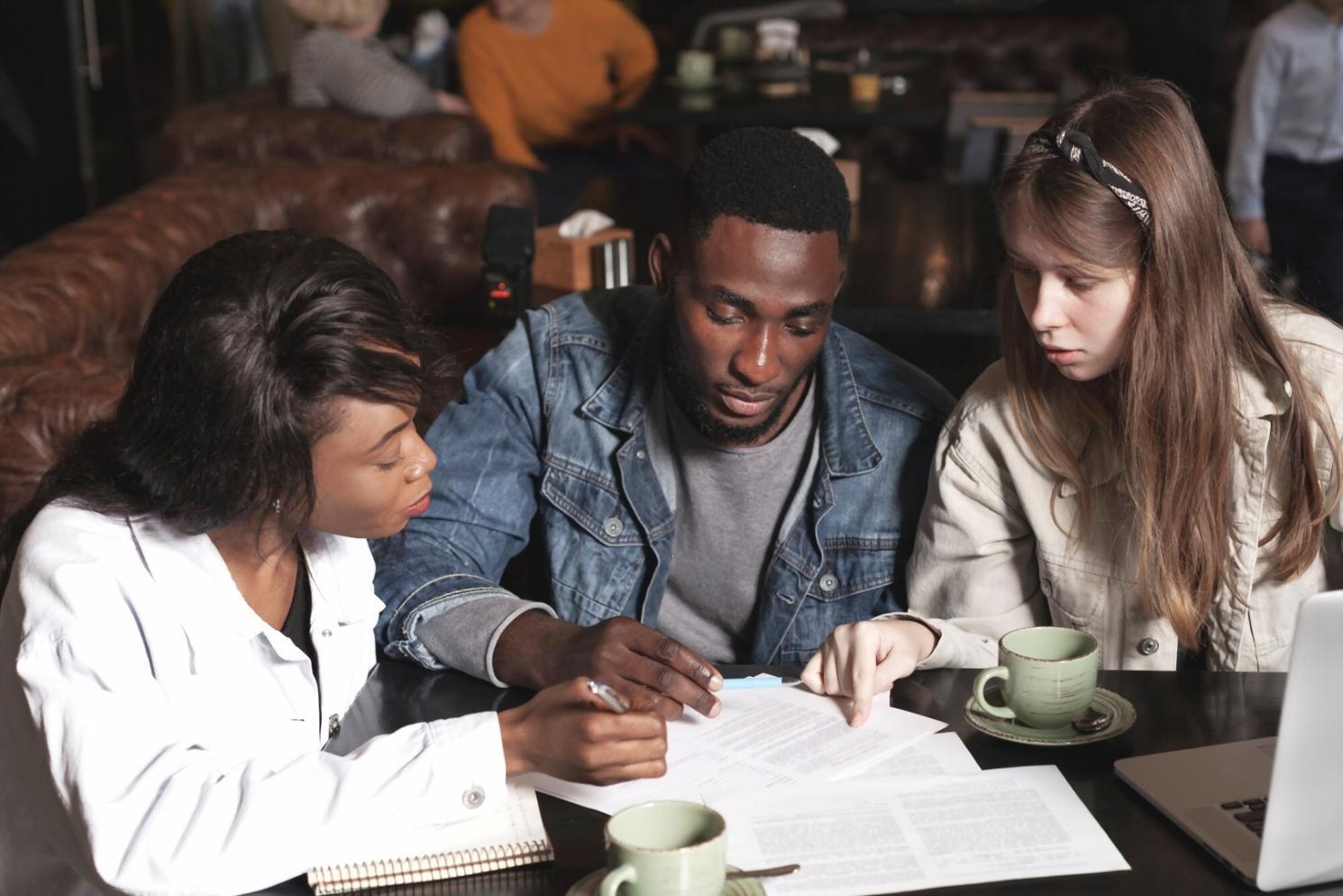 Financial consultation workspace with planning materials and open discussion